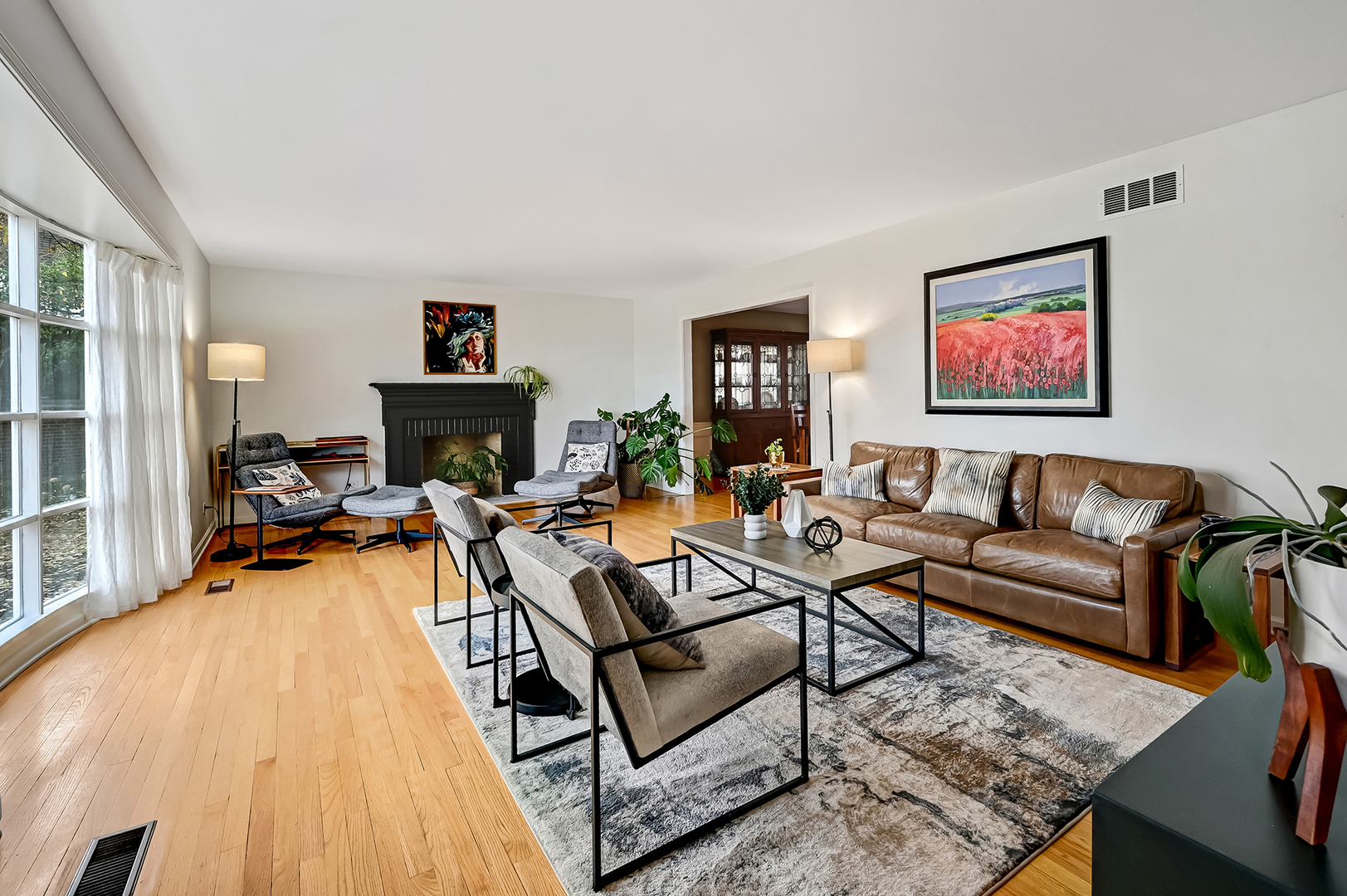 6750 County Line Lane Burr Ridge, IL 60527 - Photo 5 of 35 a living room with furniture a flat screen tv and a fireplace