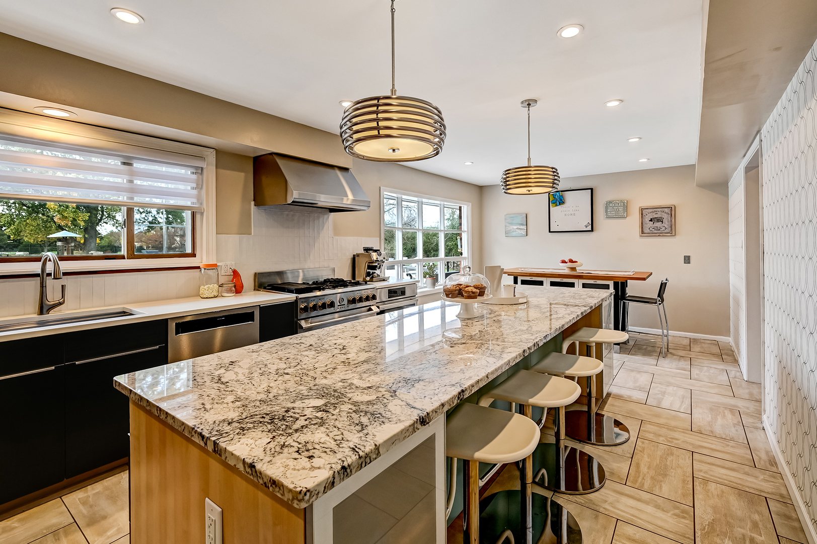 6750 County Line Lane Burr Ridge, IL 60527 - Photo 9 of 35 a kitchen with stainless steel appliances granite countertop a sink a stove and a wooden floors