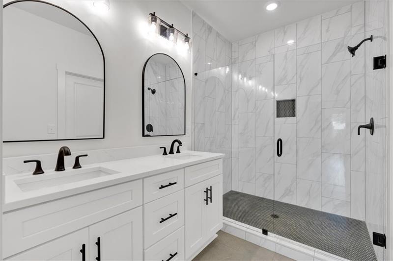 133 Old Alabama Road Southeast Emerson, GA 30137 - Photo 23 of 44 a bathroom with a double vanity sink and mirror
