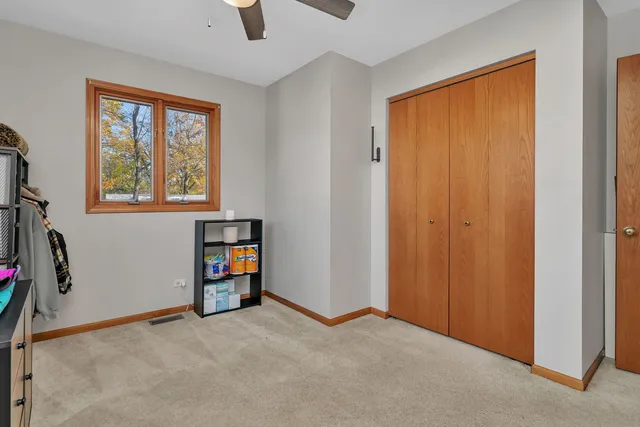 an empty room with furniture and a window