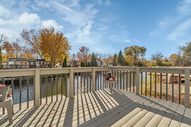 a view of balcony with wooden floor and fence
