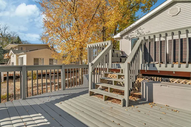 a view of wooden deck and a yard