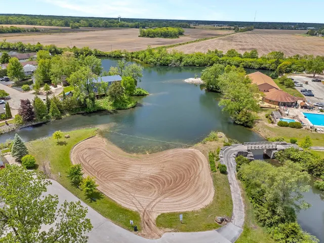 an aerial view of a house with a swimming pool