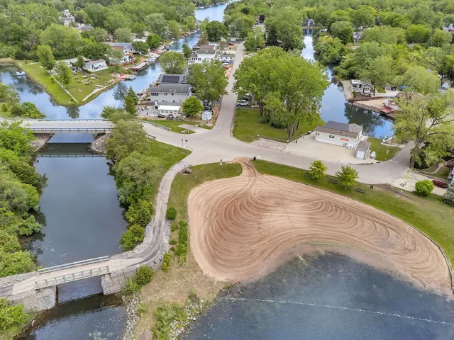 an aerial view of a city with lake view