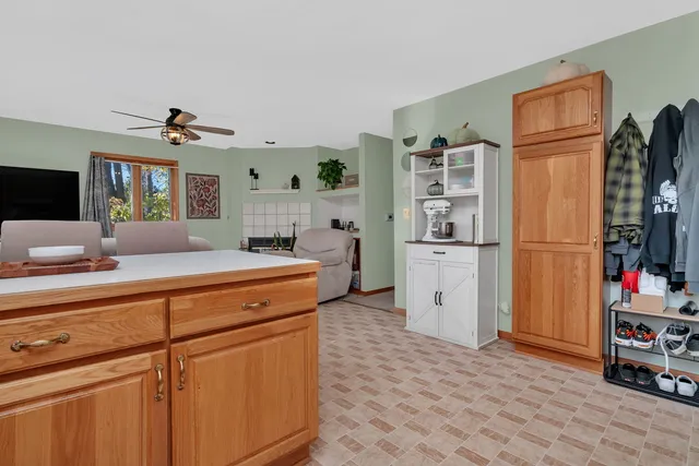 a kitchen with stainless steel appliances a refrigerator sink and cabinets