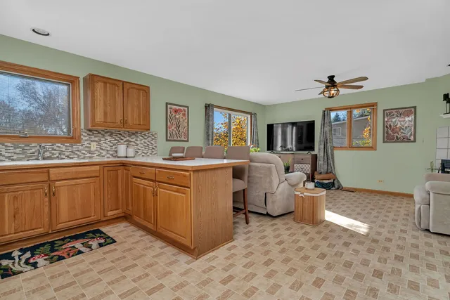 a kitchen that has a sink and a stove