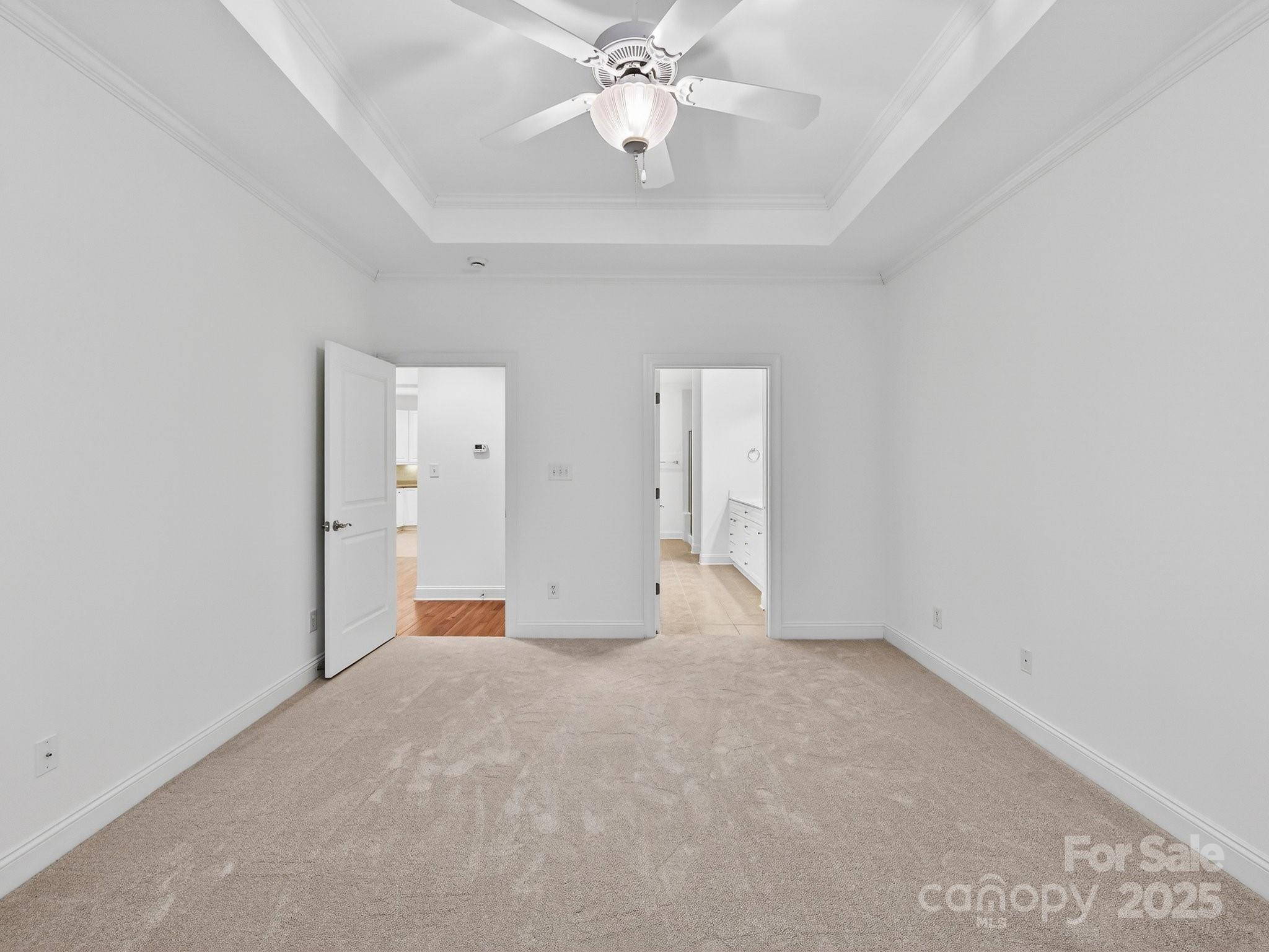 2963 Bellasera Way Matthews, NC 28105 - Photo 24 of 46 wooden floor in an empty room with a chandelier fan