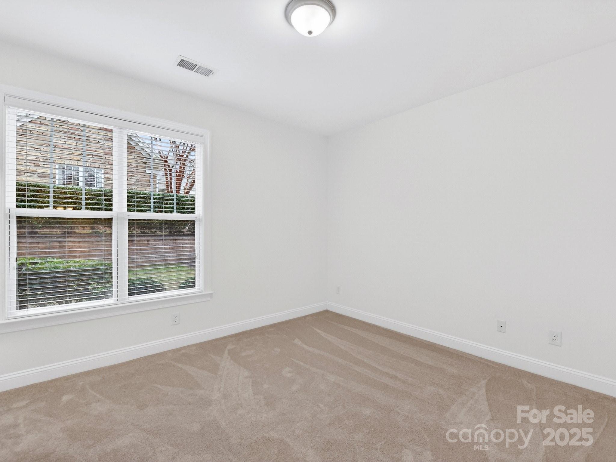 2963 Bellasera Way Matthews, NC 28105 - Photo 31 of 46 an empty room with a window