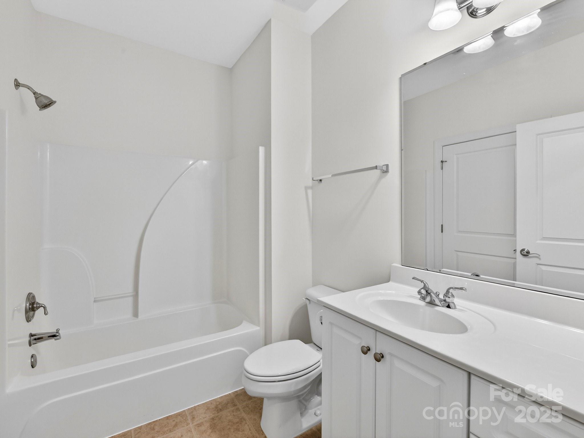 2963 Bellasera Way Matthews, NC 28105 - Photo 33 of 46 a bathroom with a sink toilet vanity and shower