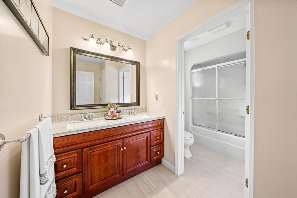 28 Gammons Road Acushnet, MA 02743 - Photo 12 of 39 a bathroom with a double vanity sink mirror and toilet