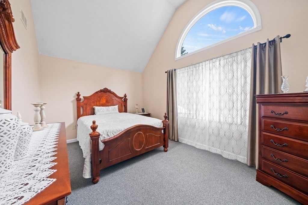 28 Gammons Road Acushnet, MA 02743 - Photo 14 of 39 a bed sitting in a bedroom next to a window