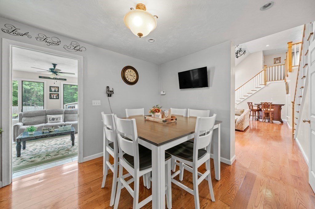 28 Gammons Road Acushnet, MA 02743 - Photo 18 of 39 a view of a dining room with furniture and wooden floor