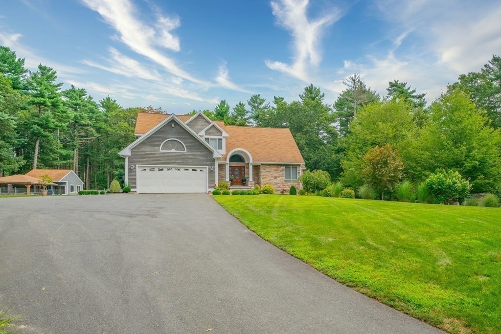 28 Gammons Road Acushnet, MA 02743 - Photo 2 of 39 a view of a house with a yard and garage