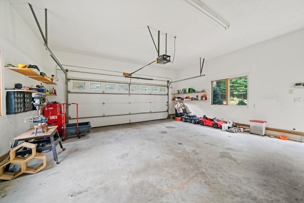 28 Gammons Road Acushnet, MA 02743 - Photo 22 of 39 a view of a garage with rack and bicycle