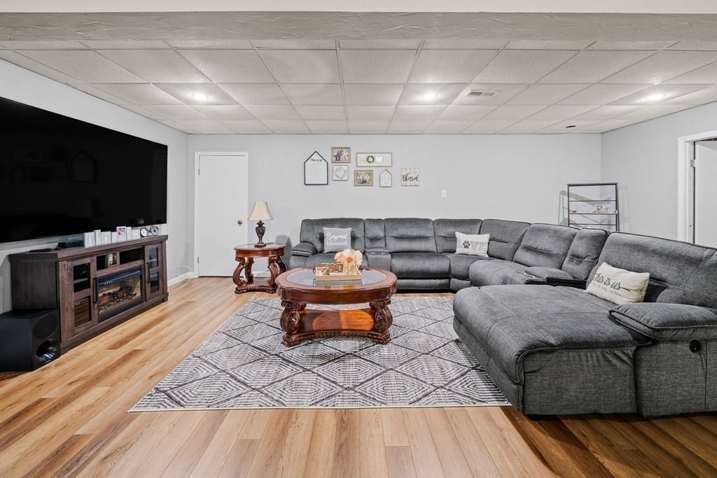 28 Gammons Road Acushnet, MA 02743 - Photo 23 of 39 a living room with furniture and a flat screen tv