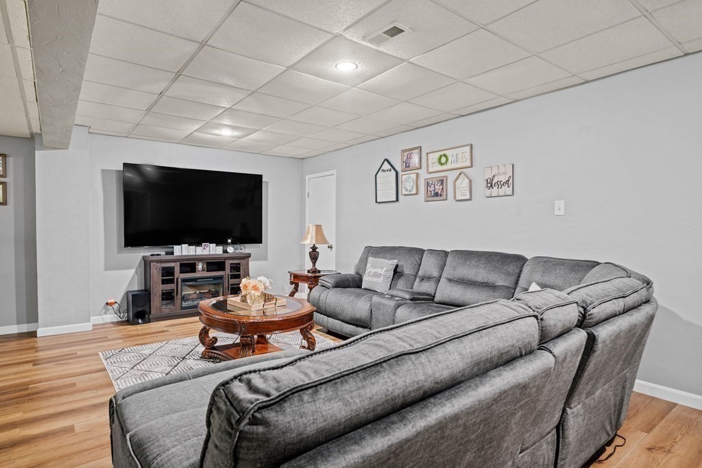 28 Gammons Road Acushnet, MA 02743 - Photo 24 of 39 a living room with furniture and a flat screen tv