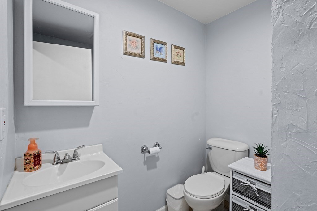 28 Gammons Road Acushnet, MA 02743 - Photo 25 of 39 a white toilet sitting next to a bathroom sink