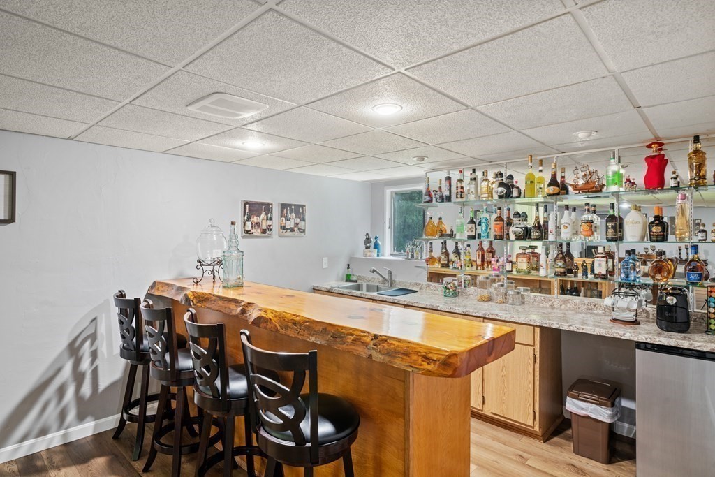 28 Gammons Road Acushnet, MA 02743 - Photo 26 of 39 a view of a dining area with furniture and a chandelier
