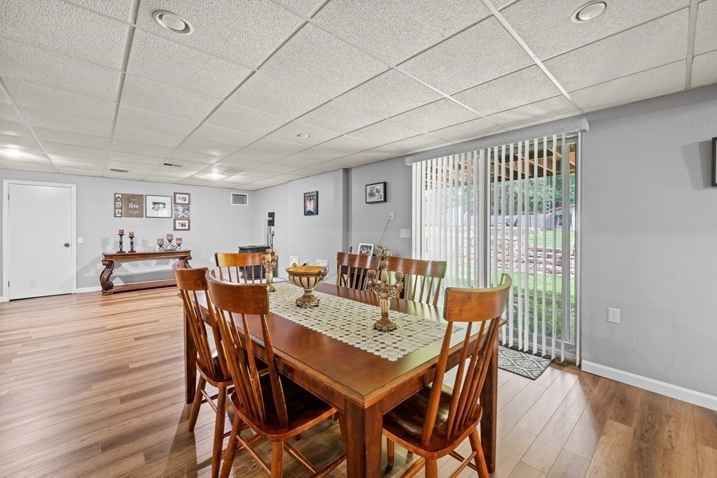 28 Gammons Road Acushnet, MA 02743 - Photo 27 of 39 a view of a dining room with furniture window and wooden floor