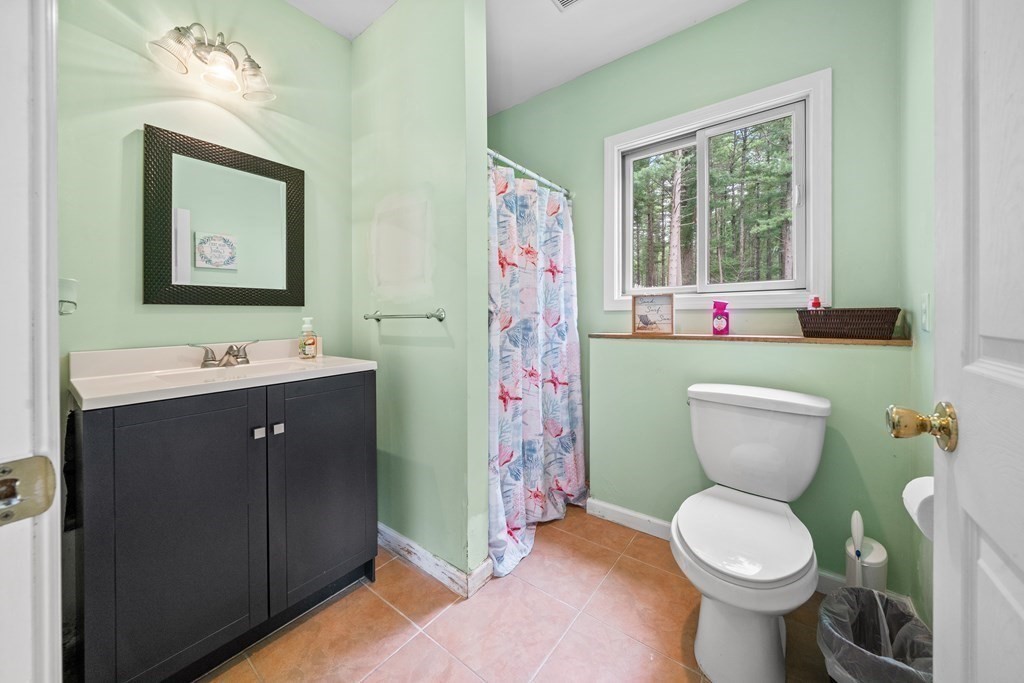28 Gammons Road Acushnet, MA 02743 - Photo 32 of 39 a bathroom with a toilet sink and mirror