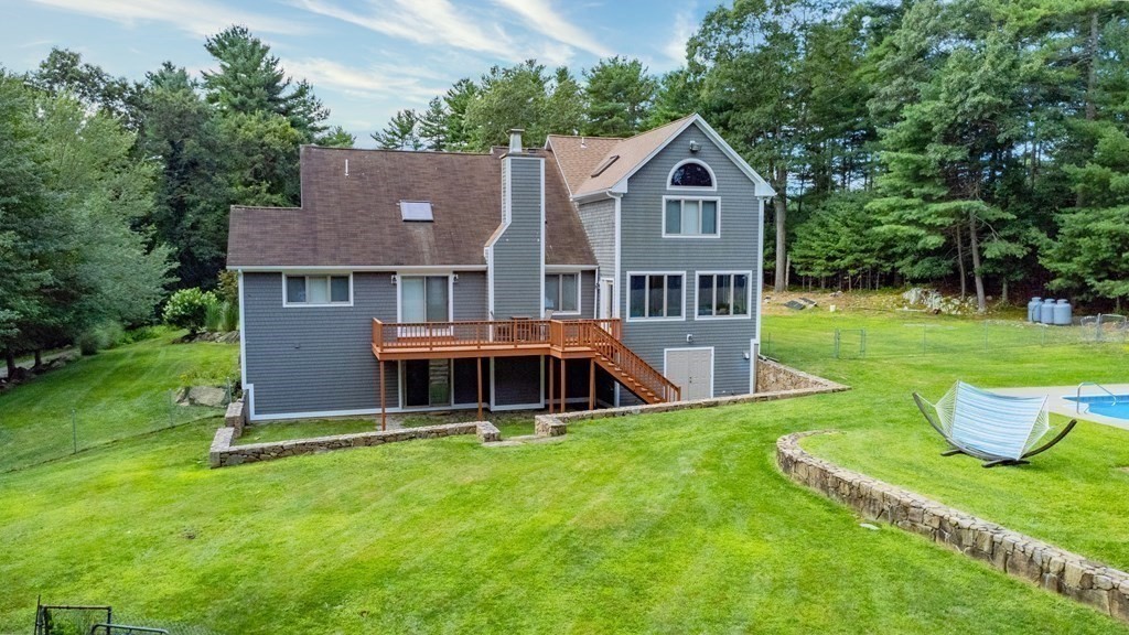 28 Gammons Road Acushnet, MA 02743 - Photo 34 of 39 a front view of a house with a yard and trees