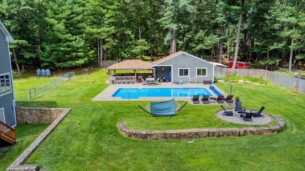 28 Gammons Road Acushnet, MA 02743 - Photo 35 of 39 a view of a house with a yard patio and fire pit