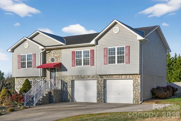 a front view of a house with yard