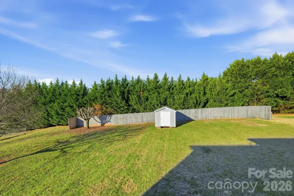 a view of a swimming pool with an outdoor seating and a yard