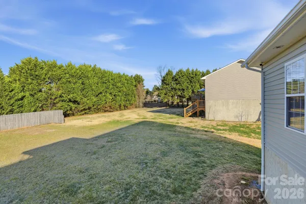 a view of a yard with an outdoor space