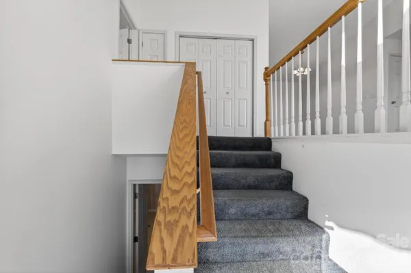 a view of staircase with black and white walls