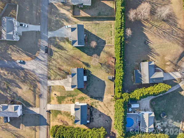 an aerial view of houses with outdoor space