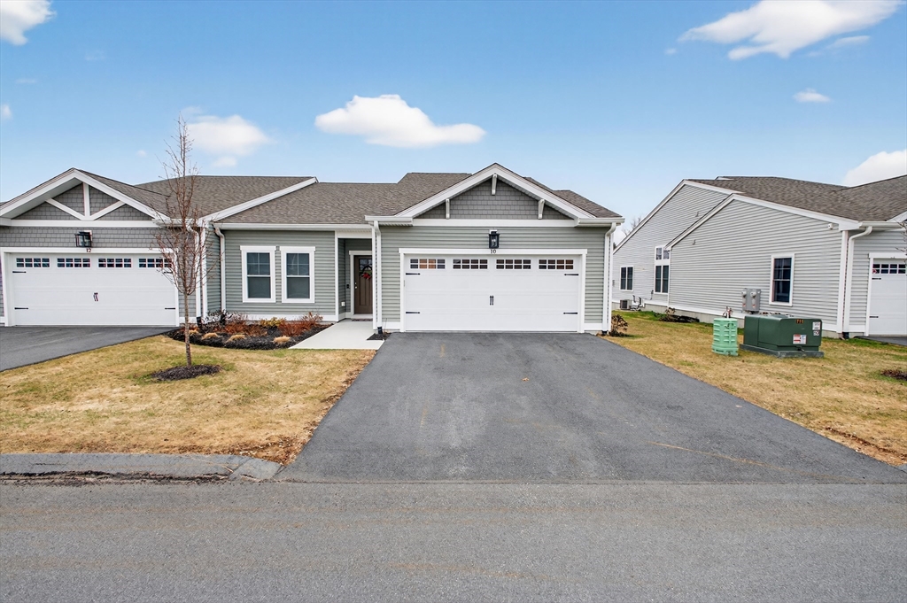 10 Logans Run, Unit 10 Millbury, MA 01527 - Photo 1 of 42 a view of a house with a yard and large tree