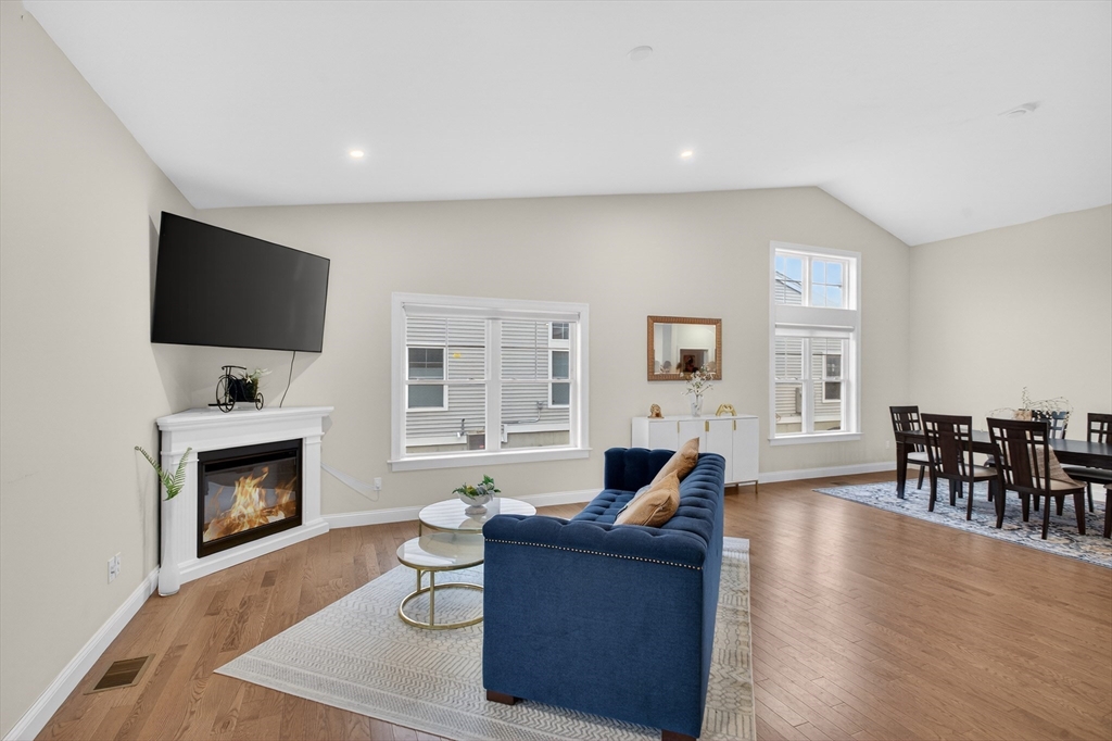 10 Logans Run, Unit 10 Millbury, MA 01527 - Photo 11 of 42 a living room with furniture fireplace and flat screen tv