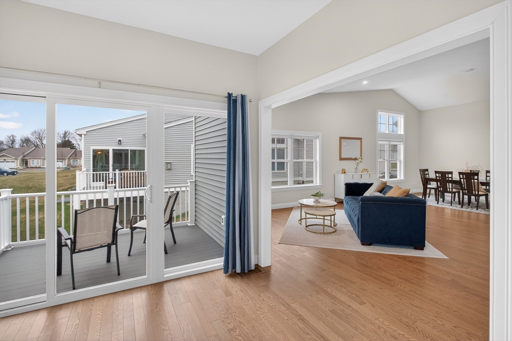 10 Logans Run, Unit 10 Millbury, MA 01527 - Photo 12 of 42 a view of a dining room with furniture and wooden floor