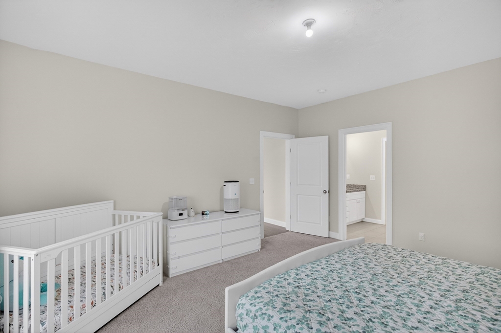 10 Logans Run, Unit 10 Millbury, MA 01527 - Photo 22 of 42 a bedroom with a white bed