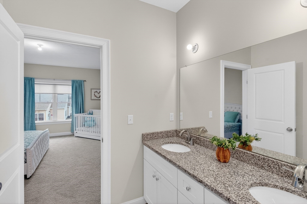 10 Logans Run, Unit 10 Millbury, MA 01527 - Photo 23 of 42 a bathroom with sink and mirror