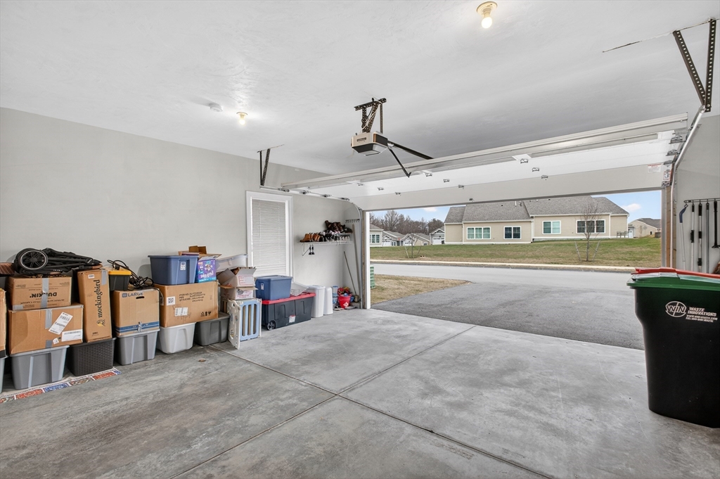 10 Logans Run, Unit 10 Millbury, MA 01527 - Photo 3 of 42 a view of a room with gym equipment