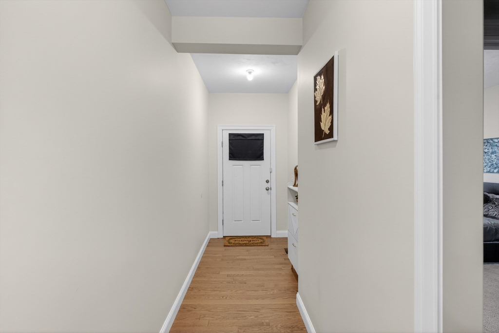 10 Logans Run, Unit 10 Millbury, MA 01527 - Photo 32 of 42 a view of a hallway