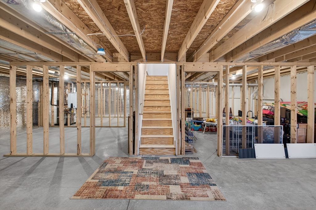 10 Logans Run, Unit 10 Millbury, MA 01527 - Photo 33 of 42 a view of a room with wooden walls