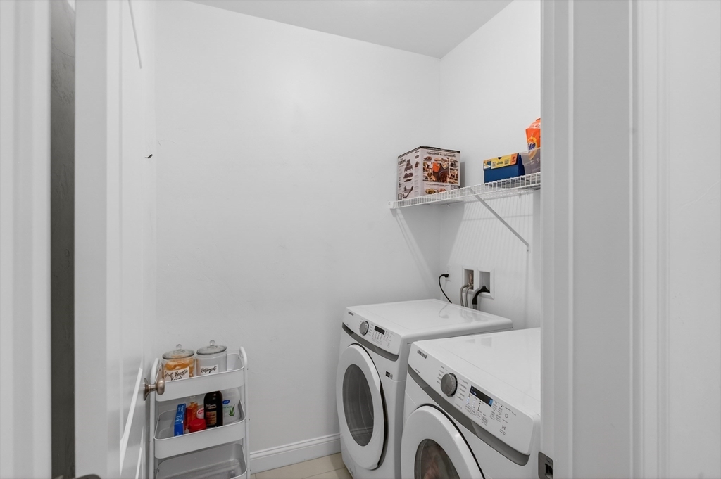 10 Logans Run, Unit 10 Millbury, MA 01527 - Photo 4 of 42 a utility room with dryer and washer