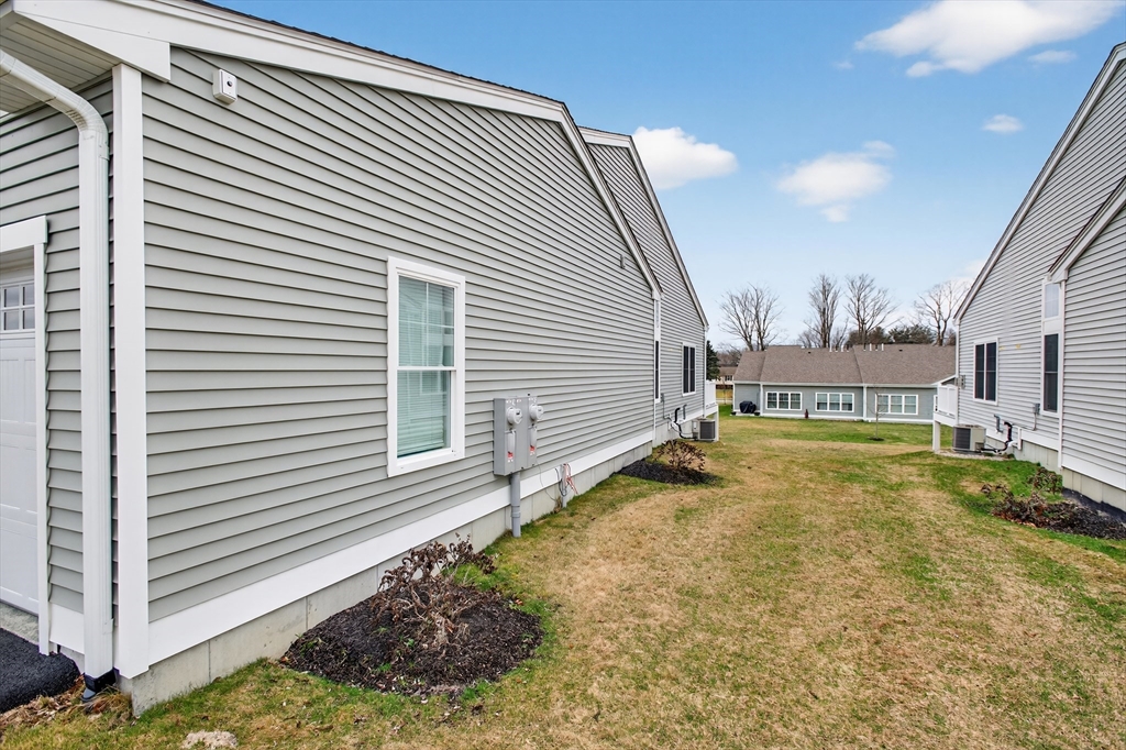 10 Logans Run, Unit 10 Millbury, MA 01527 - Photo 42 of 42 a view of a house with a backyard