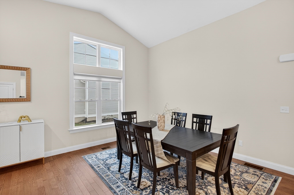 10 Logans Run, Unit 10 Millbury, MA 01527 - Photo 7 of 42 a view of a dining room with furniture and wooden floor