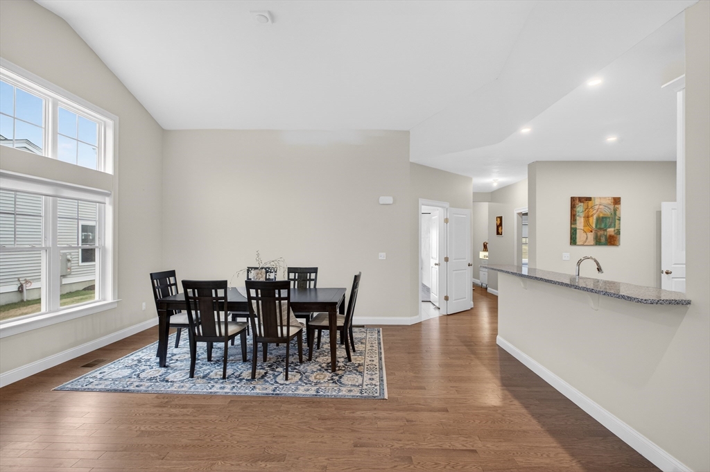 10 Logans Run, Unit 10 Millbury, MA 01527 - Photo 8 of 42 a view of a dining room with furniture window and wooden floor