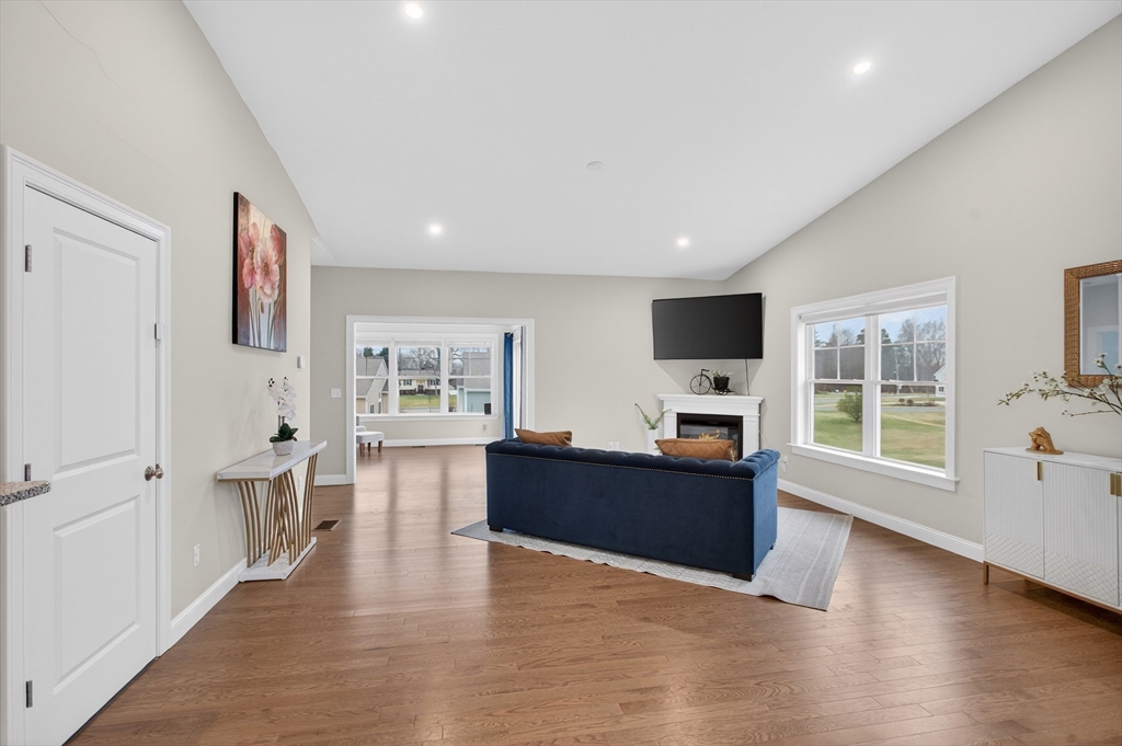 10 Logans Run, Unit 10 Millbury, MA 01527 - Photo 9 of 42 a living room with furniture and a flat screen tv