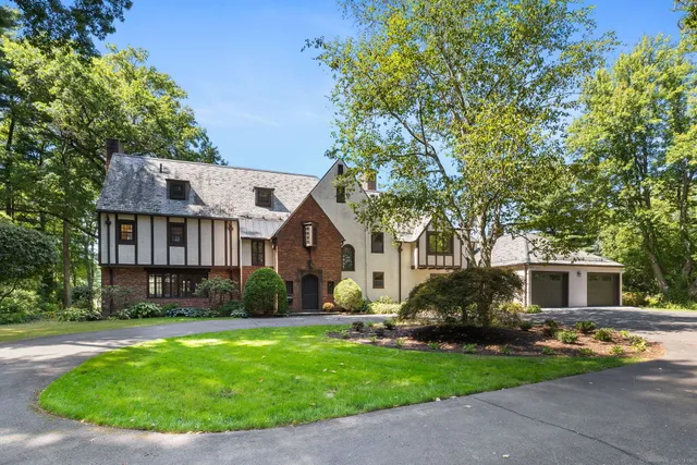 a front view of house with yard outdoor seating and green space