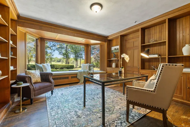 a room with furniture and a large window