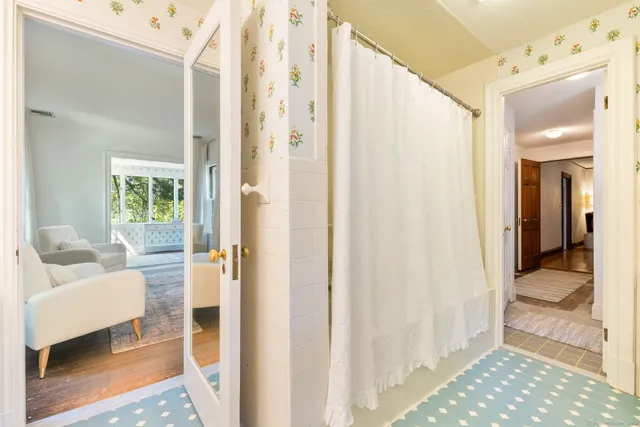 a bathroom with a tub and shower