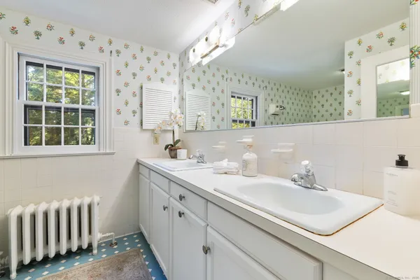a bathroom with a sink and a mirror