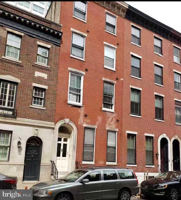1100-2 Spruce Street, Unit 2F Philadelphia, PA 19107 - Photo 1 of 11 a front view of a building with parking space