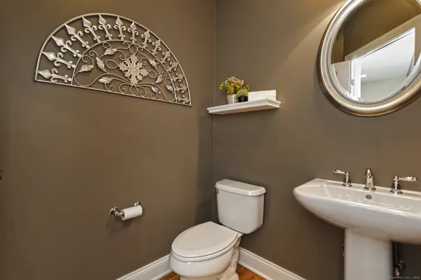a bathroom with a toilet and a sink